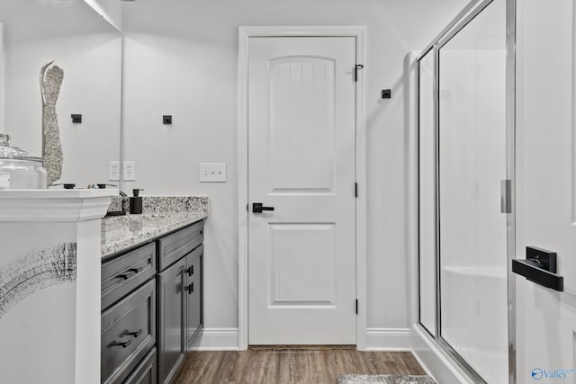 132 Fall Meadow Dr, Harvest, AL 35749 - full bath featuring a shower stall, vanity, wood finished floors, and baseboards