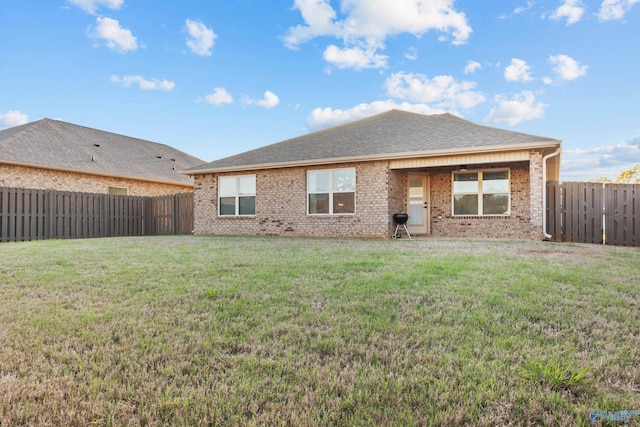 132 Fall Meadow Dr, Harvest, AL 35749 - rear view of house with brick siding and roof with shingles