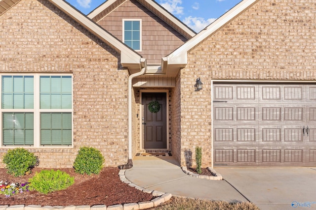 132 Fall Meadow Dr, Harvest, AL 35749 - view of exterior entry with a garage, brick siding, and concrete driveway