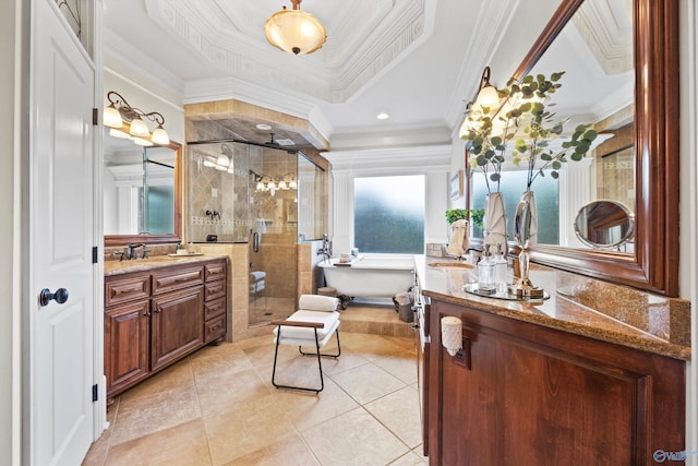 bathroom featuring plus walk in shower, a wealth of natural light, vanity, a raised ceiling, and crown molding