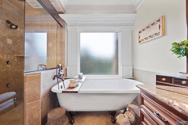 bathroom with tile walls, crown molding, tile patterned floors, and separate shower and tub