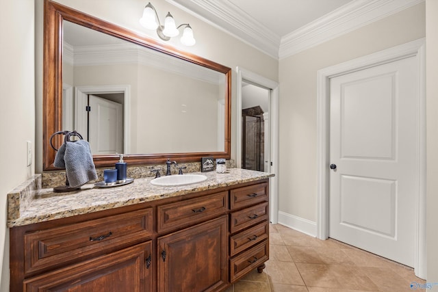 bathroom featuring vanity, tile patterned floors, and ornamental molding