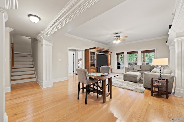 dining room with crown molding, ceiling fan, light hardwood / wood-style floors, and ornate columns