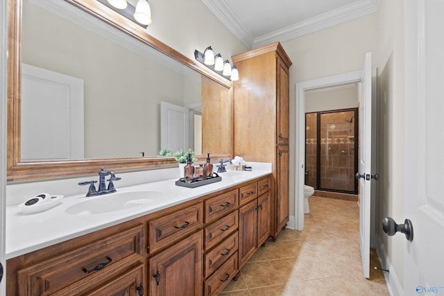 bathroom featuring a shower with shower door, ornamental molding, vanity, toilet, and tile patterned floors