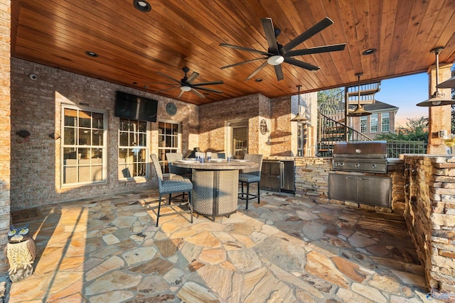 view of patio with area for grilling, grilling area, and ceiling fan