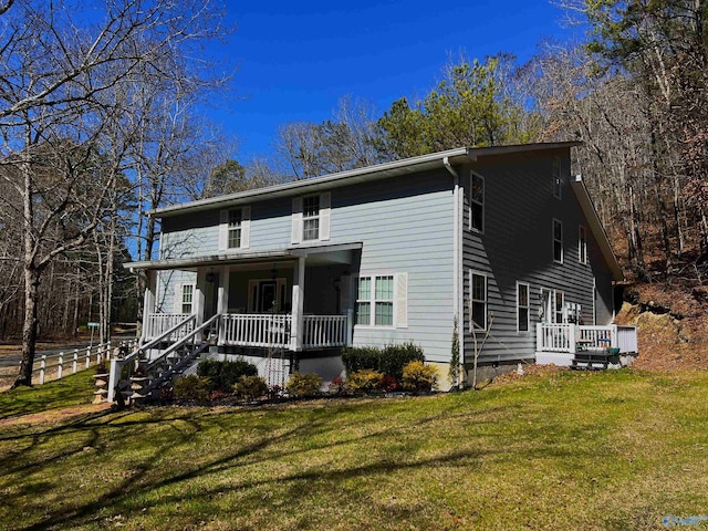 view of front facade featuring a porch and a front yard