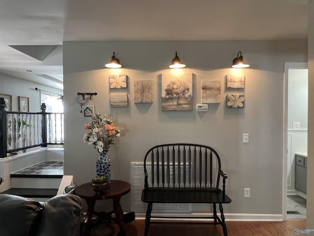 interior space featuring baseboards and wood finished floors