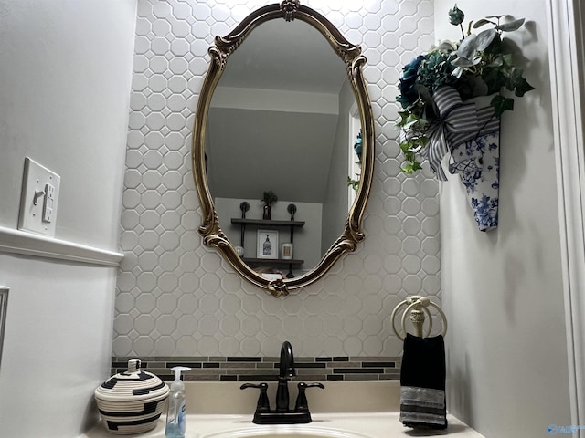 interior details with backsplash and a sink