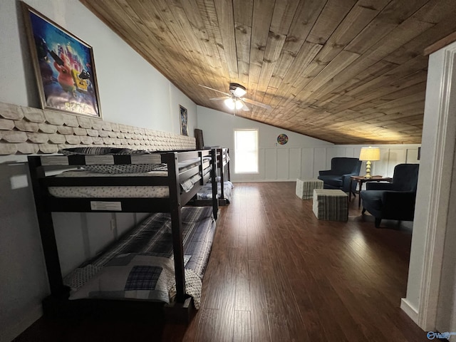 bedroom with lofted ceiling, wood ceiling, and wood finished floors