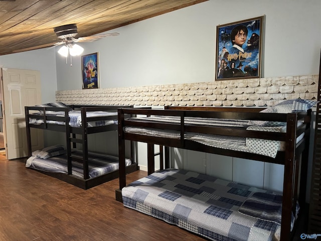 bedroom featuring lofted ceiling, wood ceiling, and wood finished floors