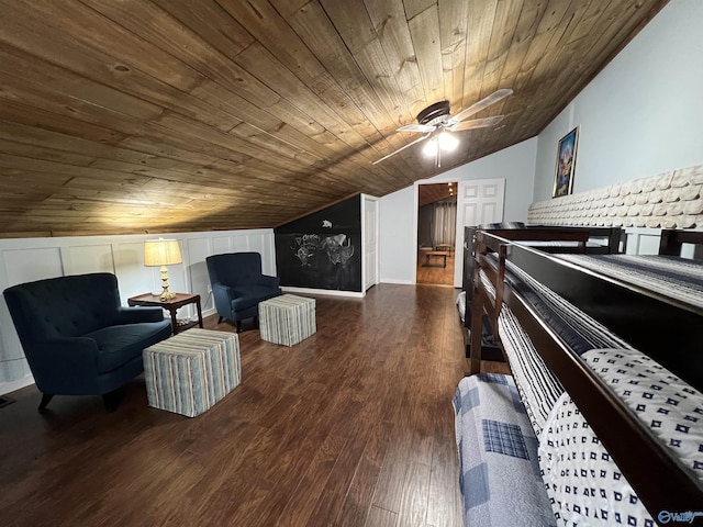 sitting room featuring lofted ceiling, ceiling fan, wood finished floors, and wood ceiling