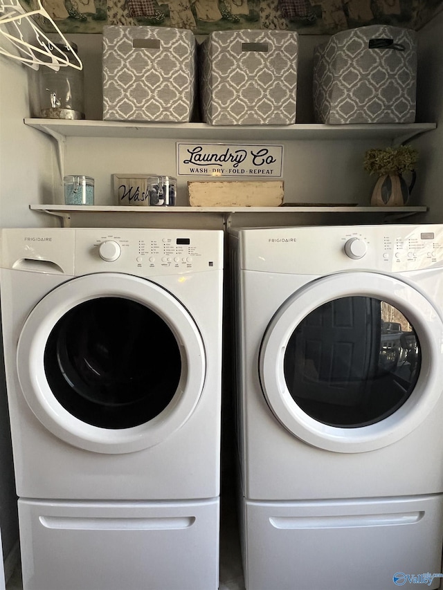 laundry room featuring washer and dryer and laundry area