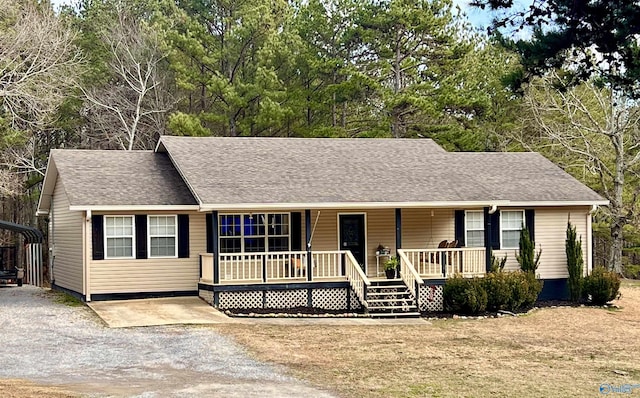 ranch-style home with a carport and covered porch