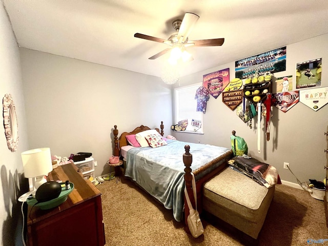 bedroom with ceiling fan and light carpet