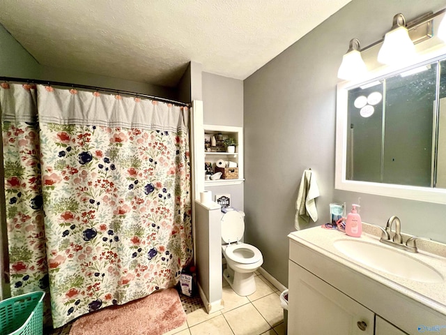 bathroom featuring tile patterned floors, toilet, a shower with curtain, a textured ceiling, and vanity