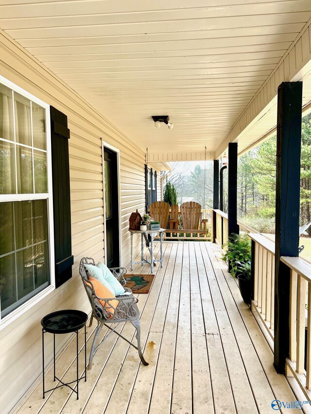 wooden terrace with covered porch