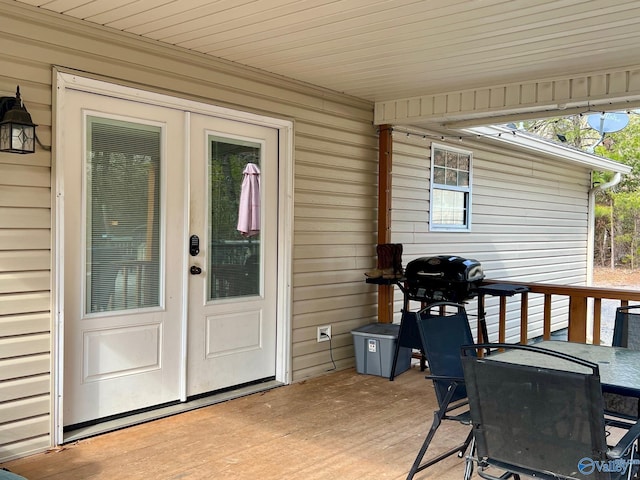 deck with grilling area and french doors