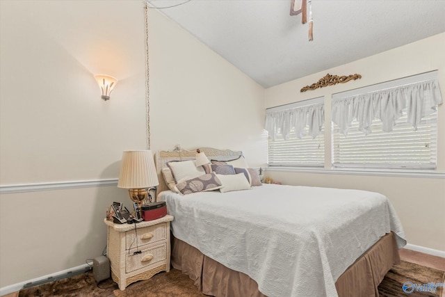 bedroom with carpet flooring and vaulted ceiling