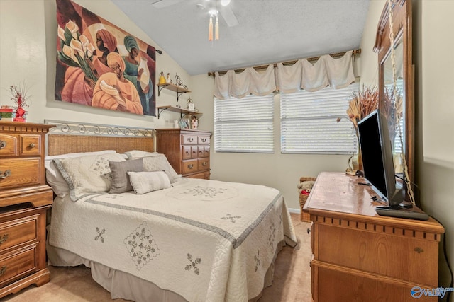 carpeted bedroom with ceiling fan, a textured ceiling, and lofted ceiling