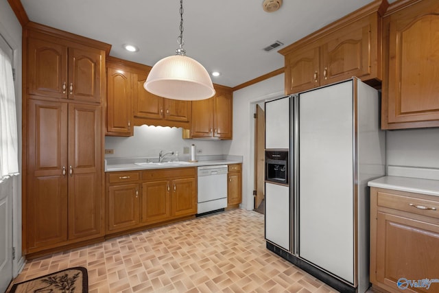 4109 Coffee Cir SW, Huntsville, AL 35805 - kitchen featuring white appliances, a sink, light countertops, brown cabinetry, and recessed lighting
