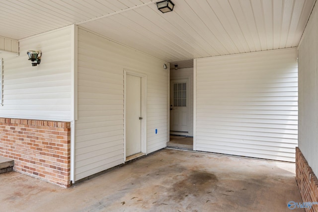 4109 Coffee Cir SW, Huntsville, AL 35805 - doorway to property with brick siding and a carport