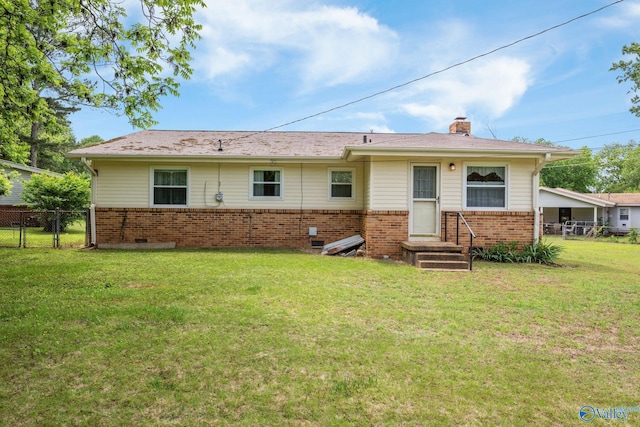 4109 Coffee Cir SW, Huntsville, AL 35805 - back of house featuring brick siding and a chimney