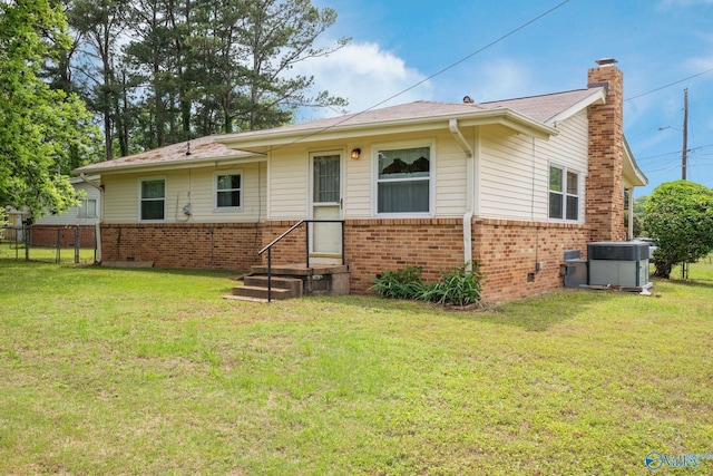 4109 Coffee Cir SW, Huntsville, AL 35805 - rear view of property featuring brick siding, central AC unit, and a chimney