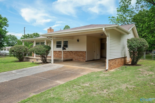 4109 Coffee Cir SW, Huntsville, AL 35805 - single story home with concrete driveway, brick siding, an attached carport, and a chimney