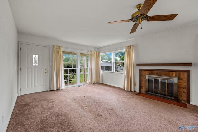 4109 Coffee Cir SW, Huntsville, AL 35805 - unfurnished living room with a fireplace, ceiling fan, carpet flooring, and baseboards