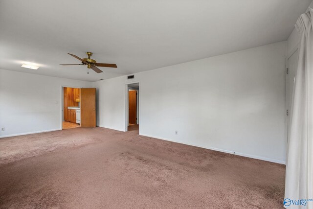4109 Coffee Cir SW, Huntsville, AL 35805 - empty room with a ceiling fan, light carpet, and baseboards