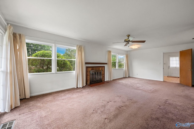 4109 Coffee Cir SW, Huntsville, AL 35805 - unfurnished living room featuring carpet, baseboards, a fireplace with flush hearth, and ceiling fan