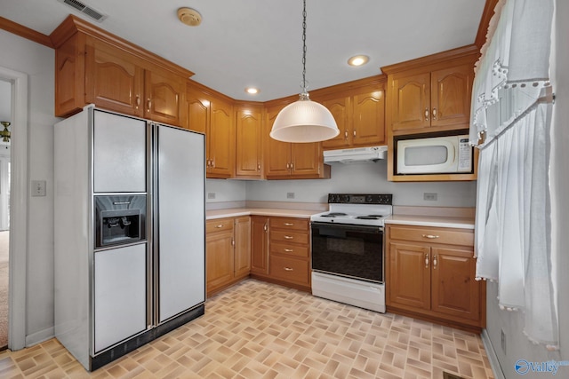 4109 Coffee Cir SW, Huntsville, AL 35805 - kitchen with white appliances, under cabinet range hood, brick patterned flooring, light countertops, and hanging light fixtures