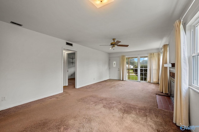 4109 Coffee Cir SW, Huntsville, AL 35805 - carpeted spare room featuring a fireplace with flush hearth, ceiling fan, and baseboards