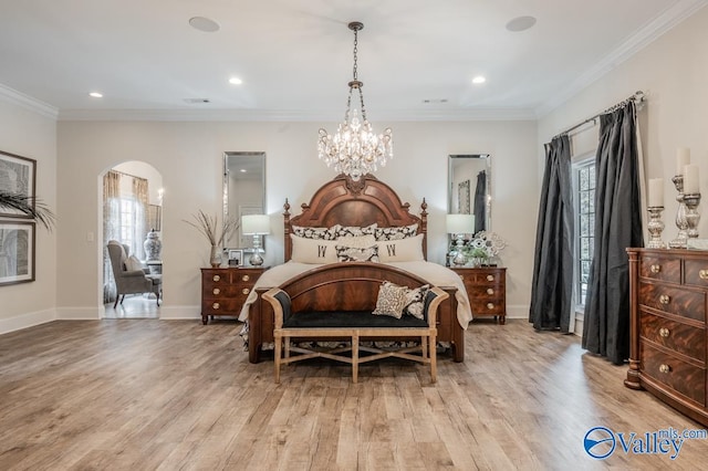 bedroom featuring an inviting chandelier, light hardwood / wood-style flooring, and ornamental molding