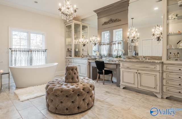 bathroom with vanity, a chandelier, ornamental molding, a tub, and tile patterned flooring