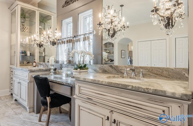 bathroom featuring vanity, tile patterned floors, and crown molding