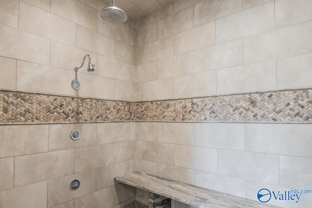 bathroom with tiled shower