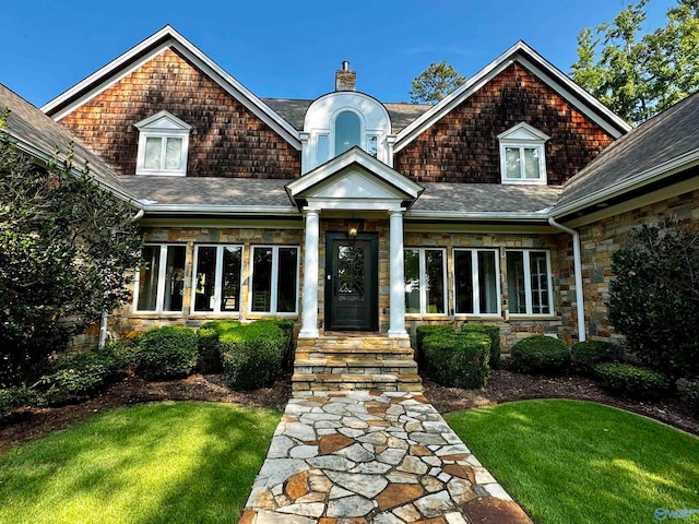 craftsman-style home with a front lawn