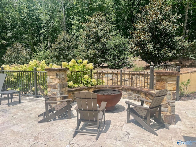 view of patio / terrace featuring an outdoor fire pit