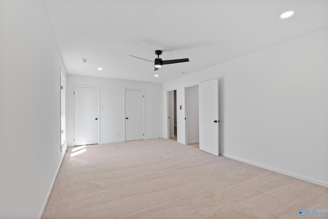 unfurnished bedroom with baseboards, carpet floors, and a textured ceiling