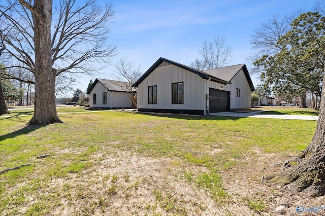 view of property exterior with an attached garage, a lawn, board and batten siding, and driveway