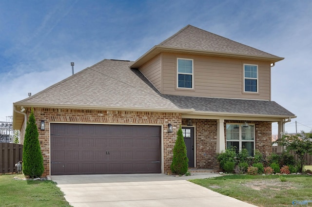 view of front of house with a garage and a front lawn