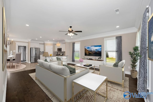 living room featuring ornamental molding, hardwood / wood-style flooring, and ceiling fan