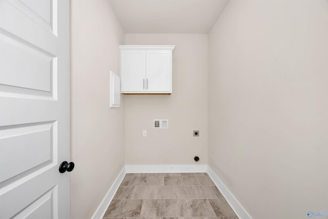 laundry area with cabinets, electric dryer hookup, and washer hookup