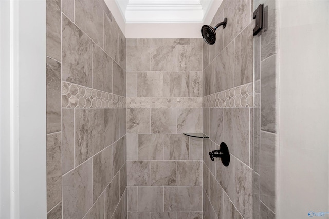 interior details featuring tiled shower