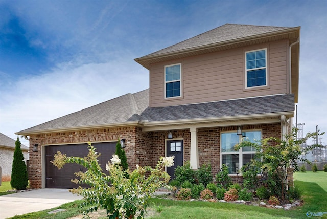 view of front facade with a garage and a front lawn