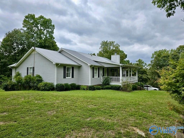 view of front of property with a front yard and a porch