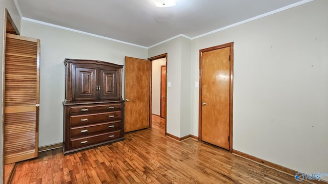 1411 W Washington St, Athens, AL 35611 - bedroom with baseboards, ornamental molding, and wood finished floors