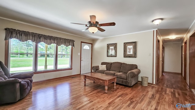1411 W Washington St, Athens, AL 35611 - living room with ornamental molding, wood finished floors, baseboards, attic access, and a ceiling fan