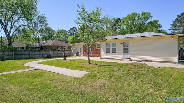 1411 W Washington St, Athens, AL 35611 - rear view of property featuring fence, crawl space, entry steps, a patio area, and a yard